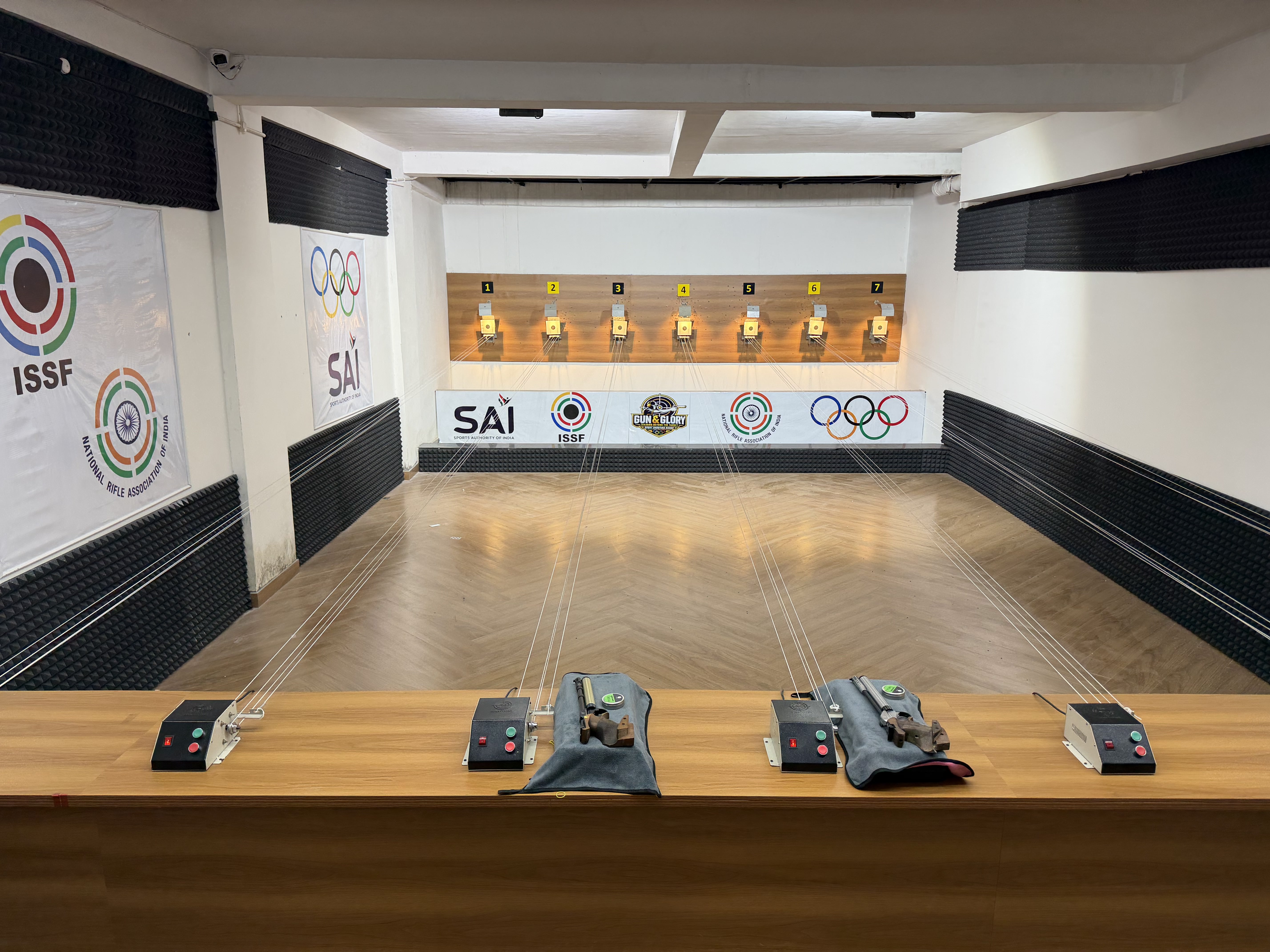 Indoor shooting range with targets at Gun & Glory Shooting Range in Gurugram